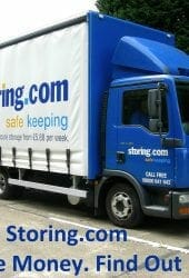 A blue and white self storage company truck parked in a lot with promotional text and website details on its side.