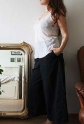 Lady thinking about hot to pack mirrors
