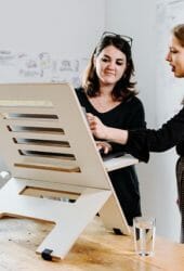 Women working on a standing desk