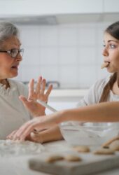 grown-up daughter helping mother