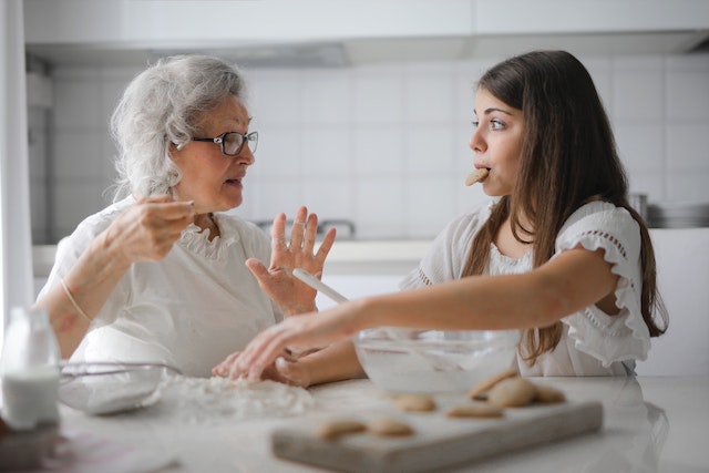grown-up daughter helping mother